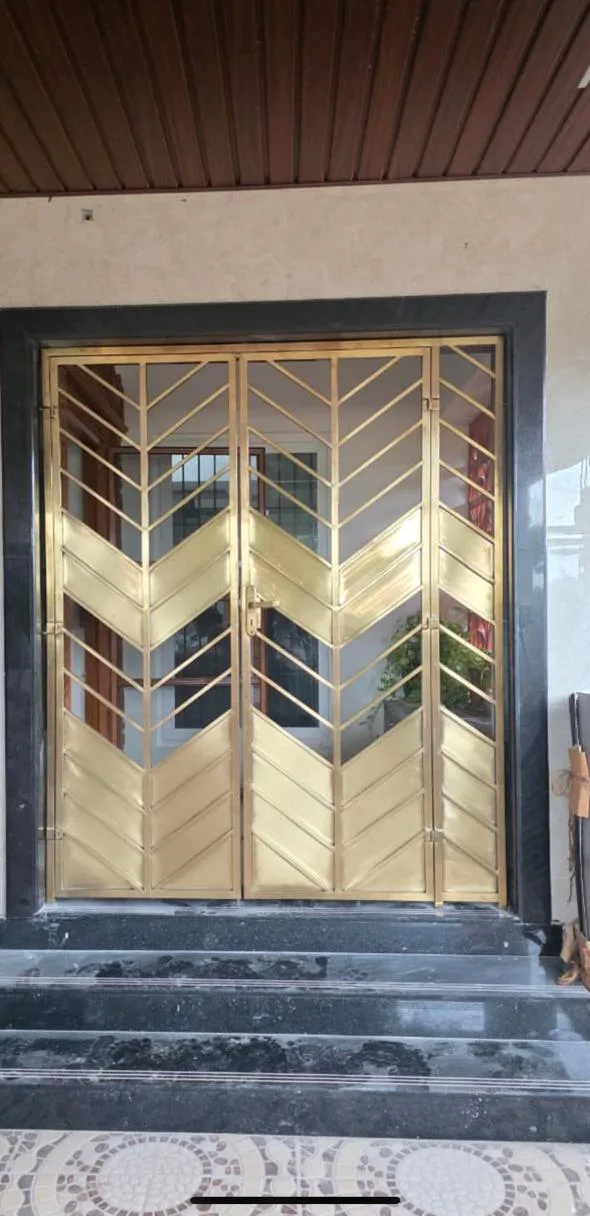 Entrance door with gold and steel chevron pattern