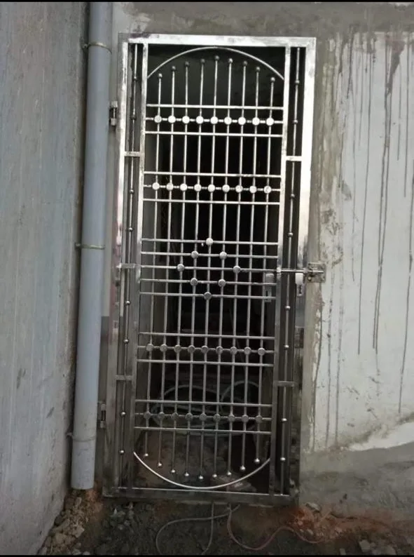 Stainless steel safety door with decorative grill