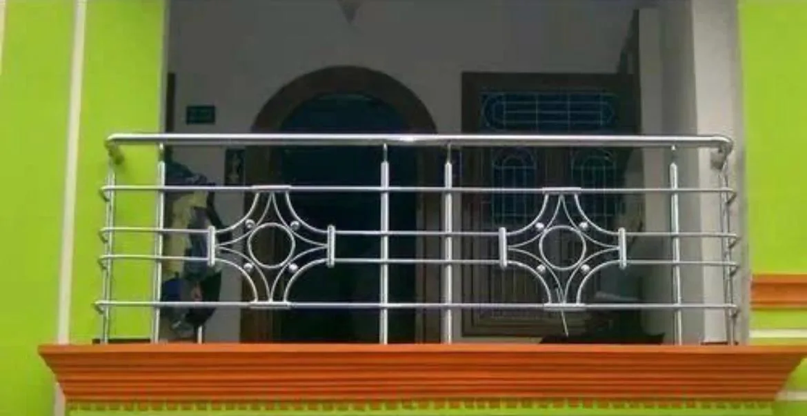 Balcony railing with decorative stainless steel motifs