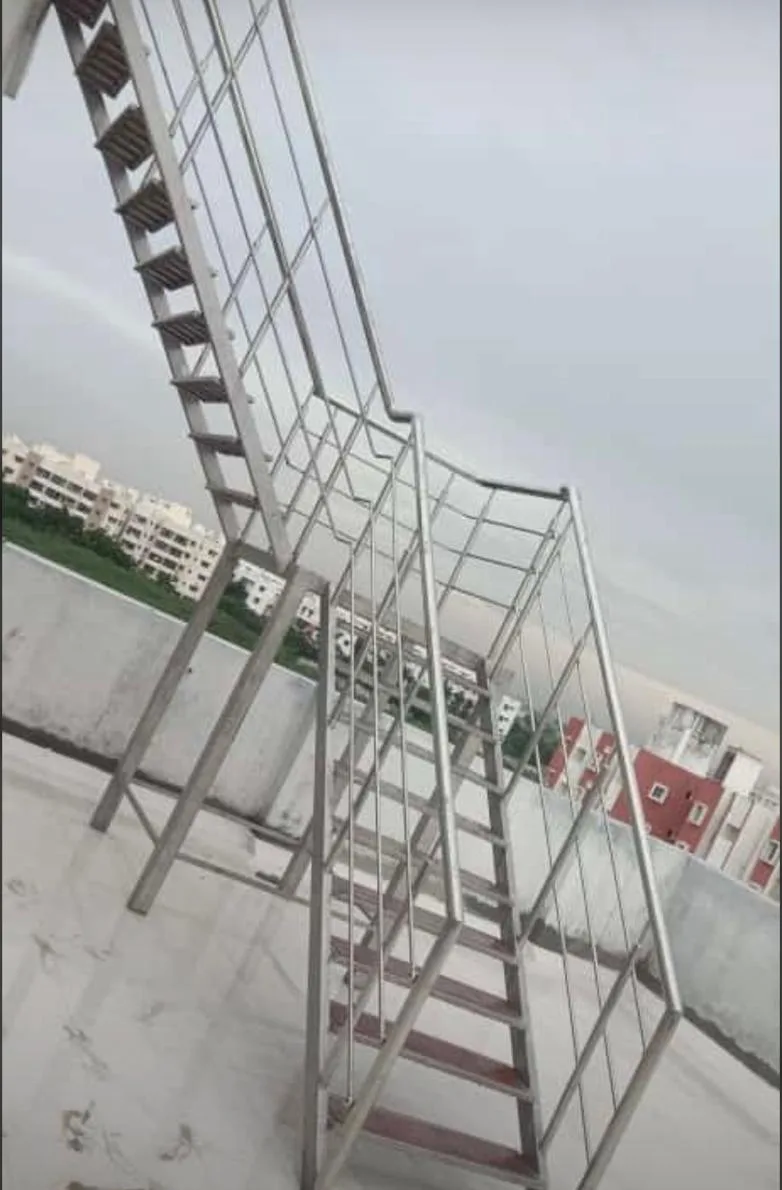 Rooftop stainless steel staircase with box railing