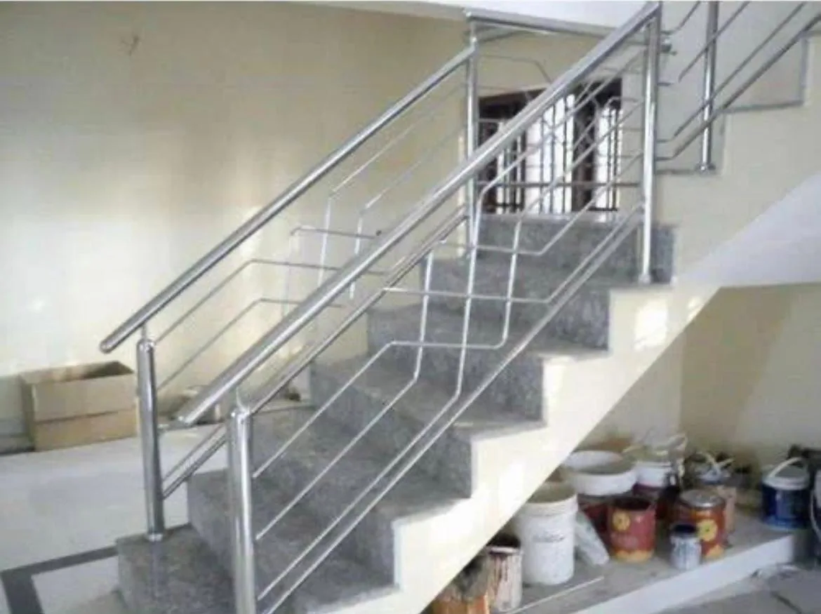 Stainless steel staircase railing with geometric infill