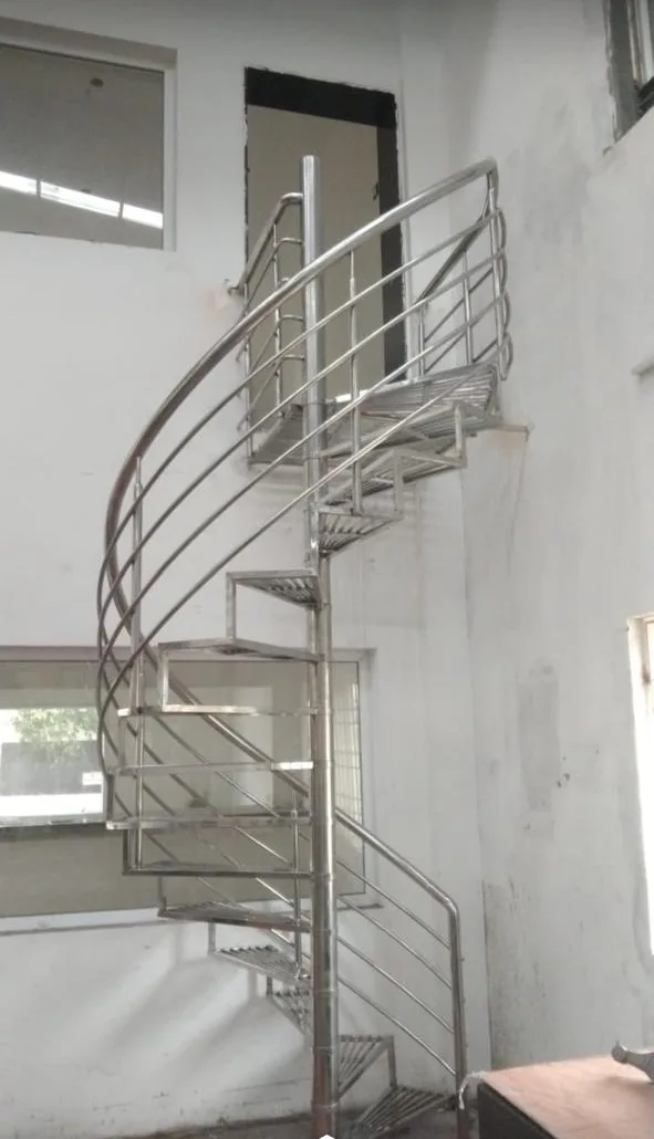 Interior spiral staircase with stainless steel railing